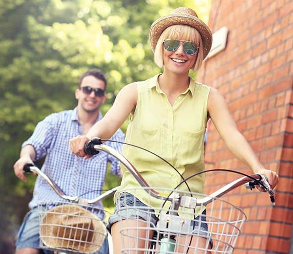 couple riding bicycle at VisionQuest Eyecare