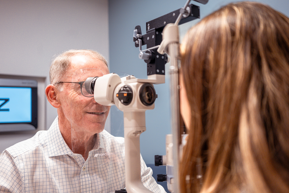 About Our Eye Doctors l VisionQuest Eyecare Indianapolis Eye doctor examining a patient.