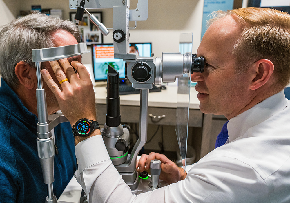 Senior Eye Care l VisionQuest Eyecare Indianapolis Eye doctor examining senior