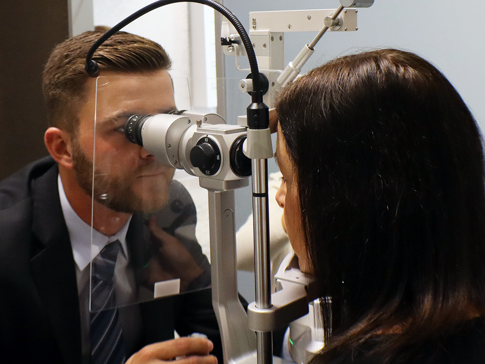 Eye doctor examining patient