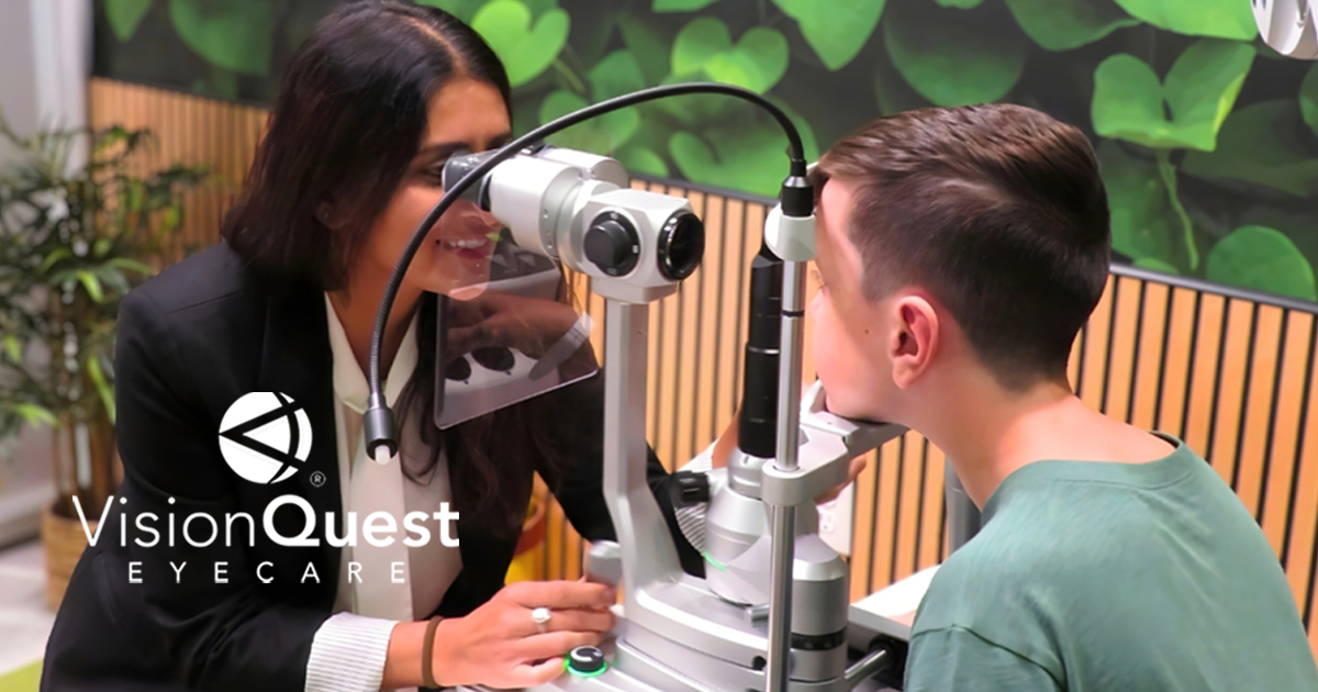 Eye doctor examining young patient